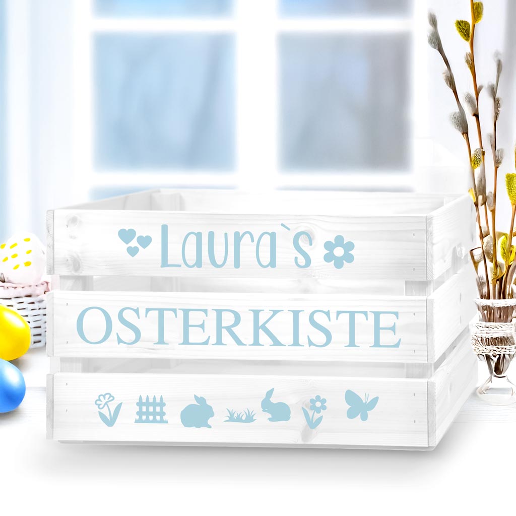 weisseholzkistemithellblauemaufkleberzumbasteeinerosterkistemitkleinenostersymbolenhaseblumeschmetterlingzaungrasherzen